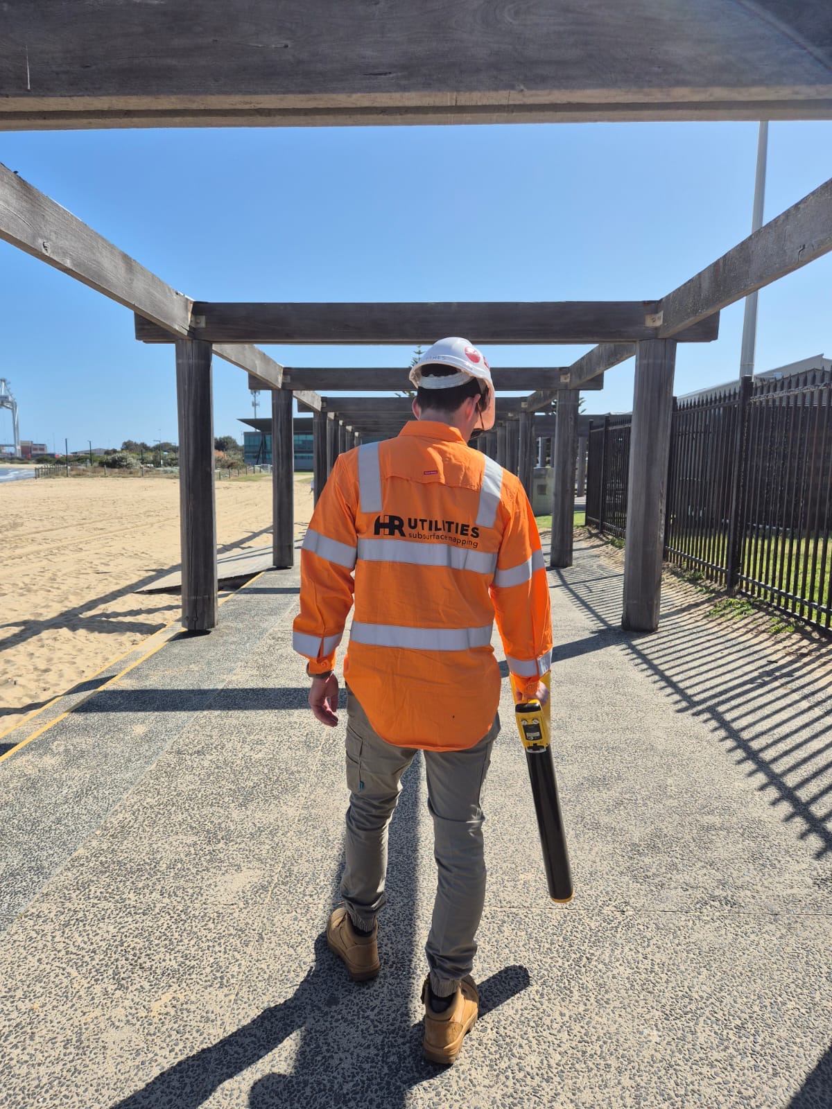 HR Utilities locator on site with electromagnetic locating equipment